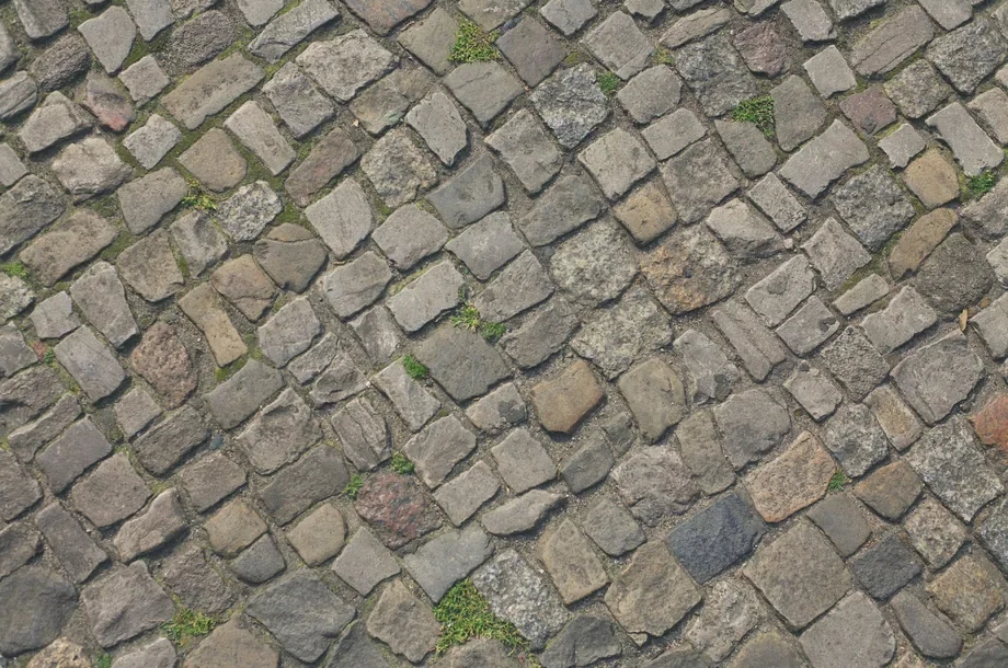 Graues Kopfsteinpflaster als Detailaufnahme